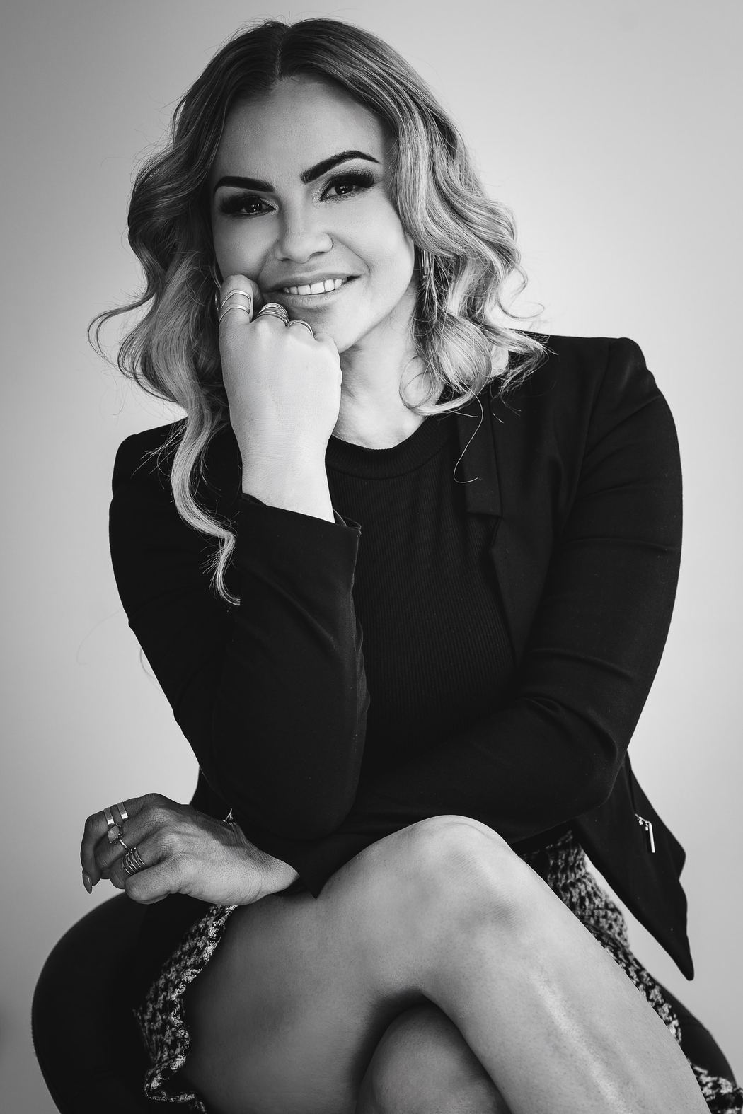 Black and white branding portrait, chin resting on her hand